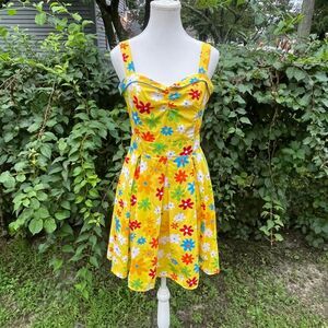 Betty Page PIn Up Yellow floral dress Retrp with red, blue, and white flowers
